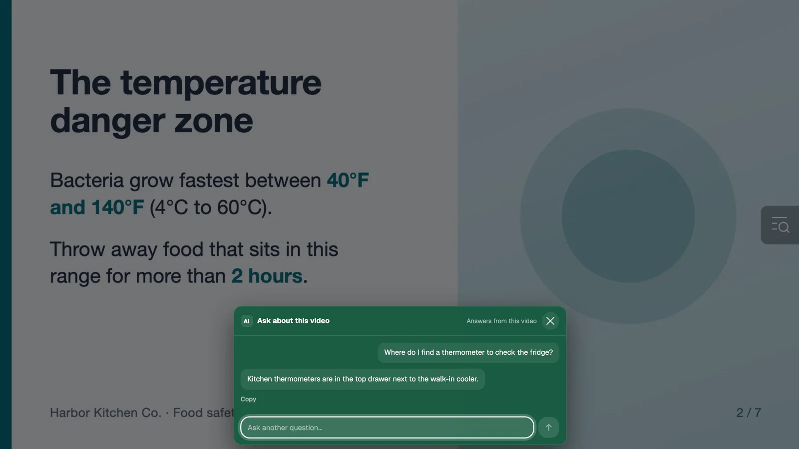 Genie panel over a training video answering a viewer question about where the kitchen thermometers are kept